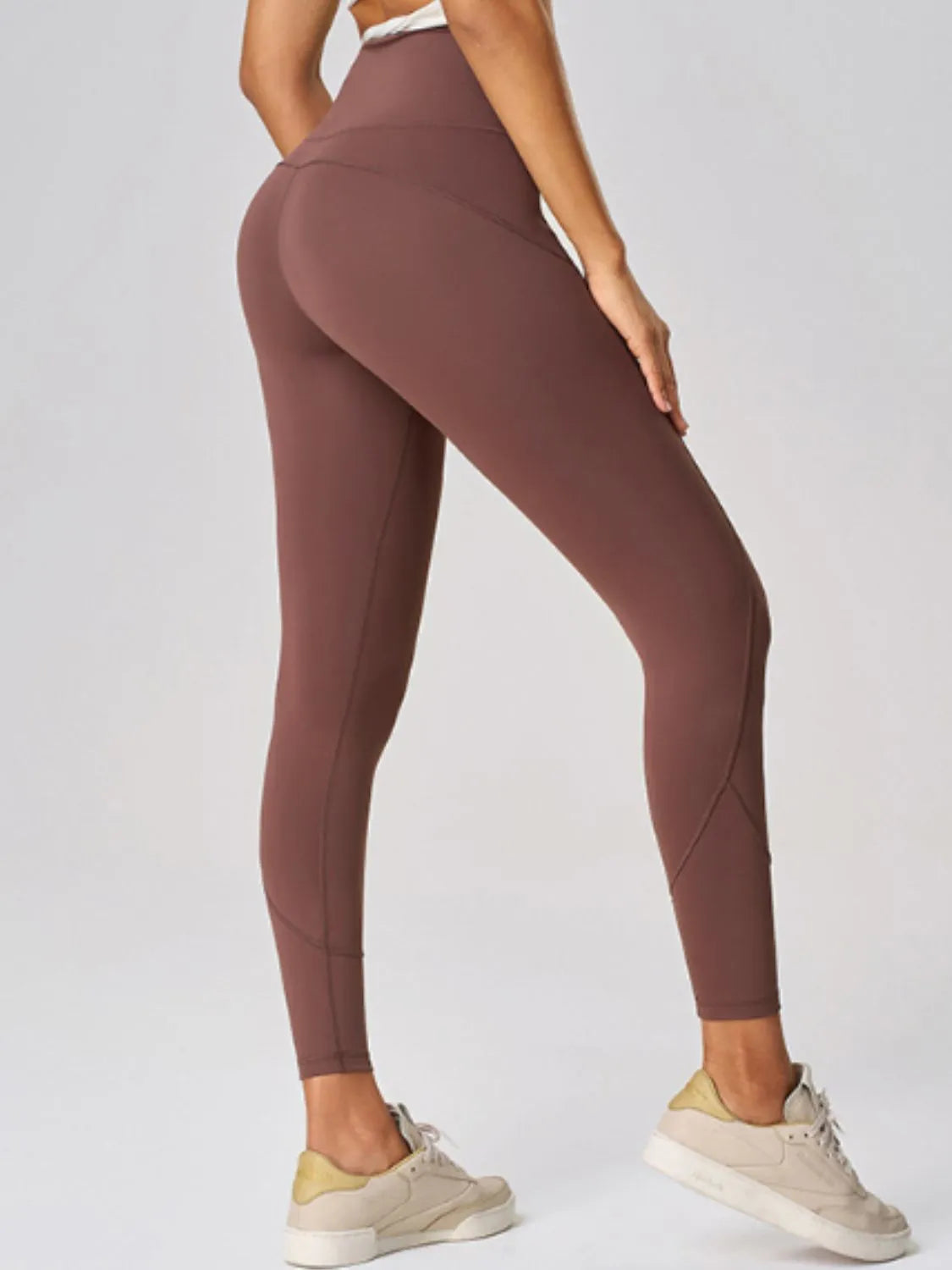Model wearing high-waisted sculpt active leggings by Flexline, body-contouring gymwear activewear