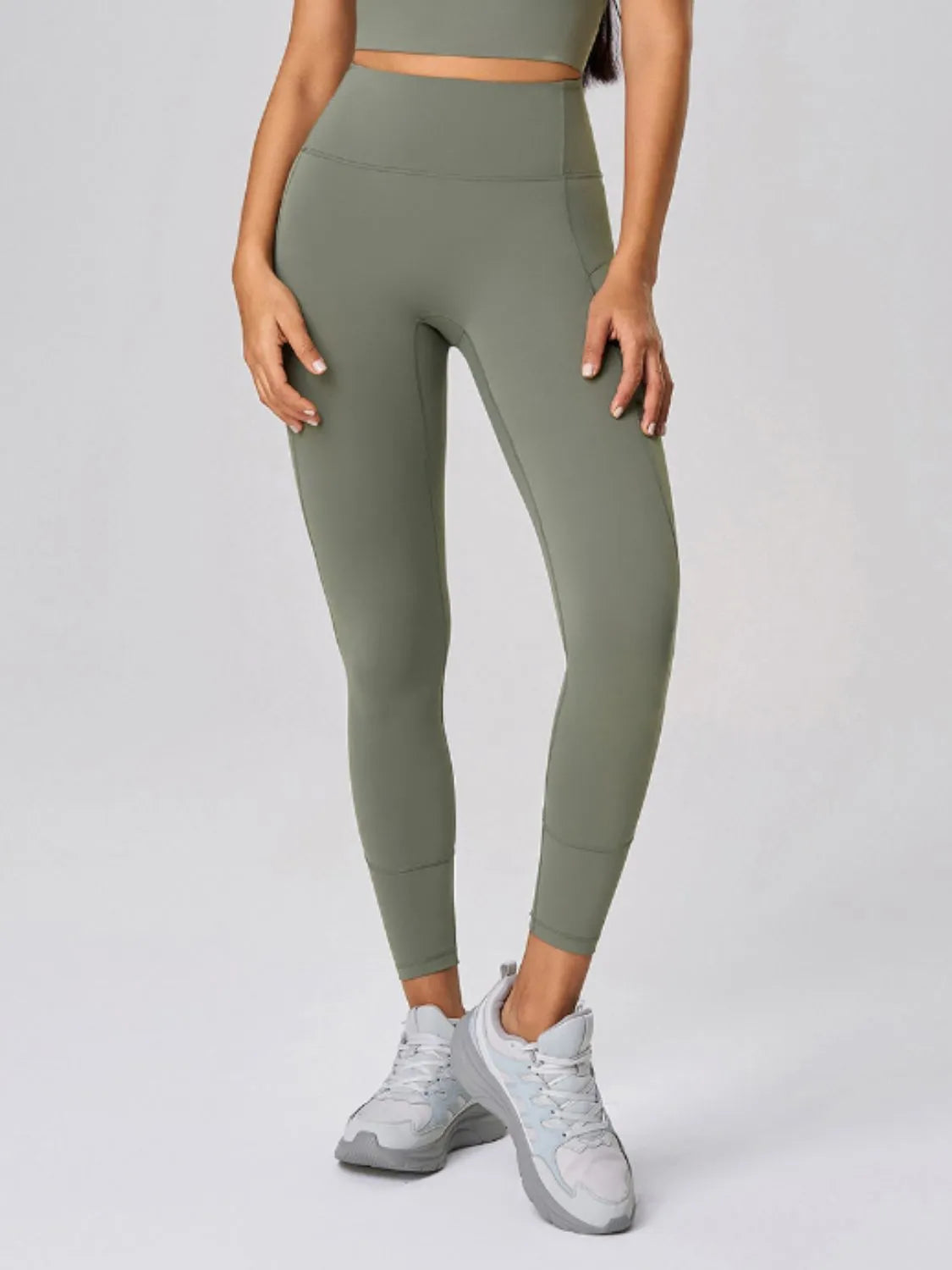 Model wearing high-waisted sculpt active leggings by Flexline, body-contouring gymwear activewear