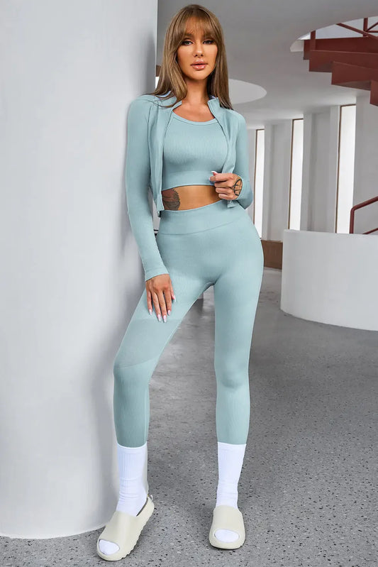 Woman wearing Power Play 3-Piece Flexline workout set with cropped tank, long sleeve top, and sculpting leggings, Sculp leggings, contour leggings, black leggings, navy blue leggings