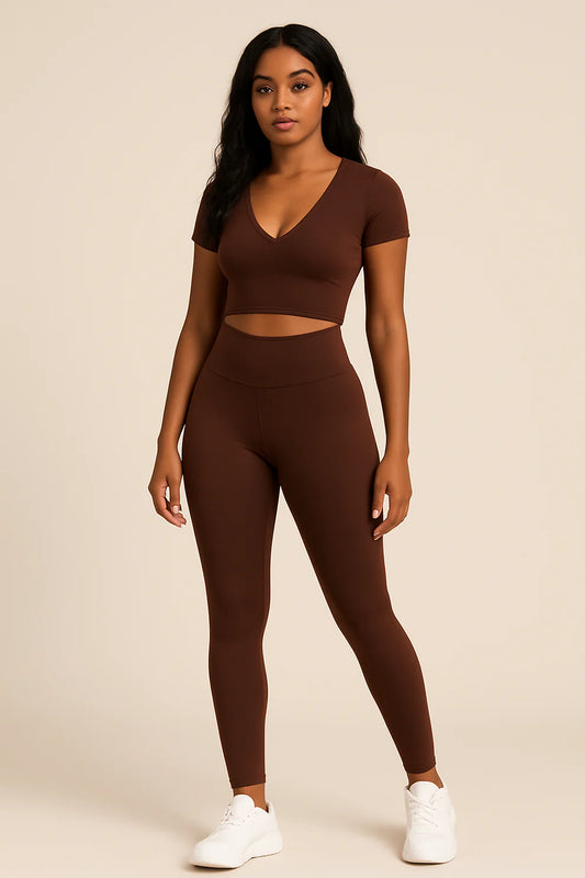 Woman wearing V-neck crop top and high-waisted active pants set from Flexline, sleek body-hugging fit