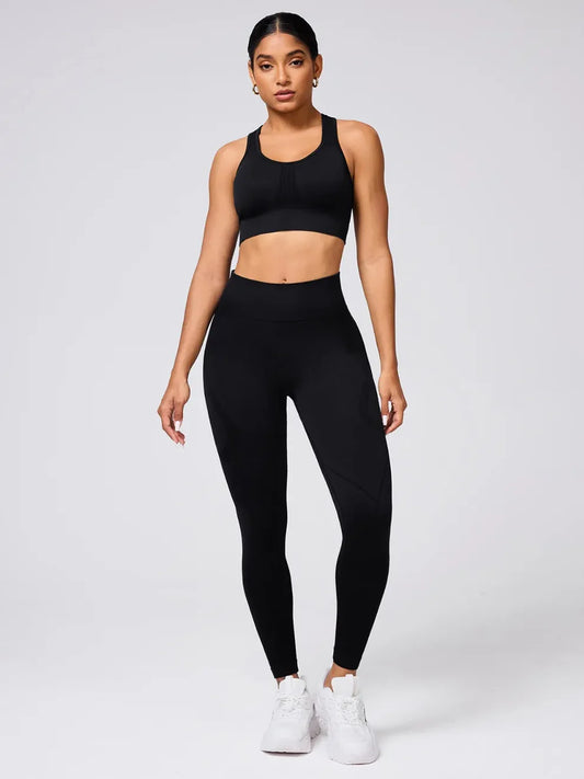 Model wearing women’s crisscross back tank and high waist leggings set from Flexline, sculpting 2-piece workout outfit