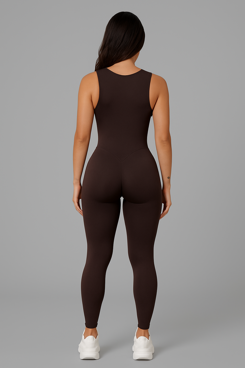 Model wearing women’s half zip one-piece sculpting workout jumpsuit from Flexline, wide-strap active bodysuit